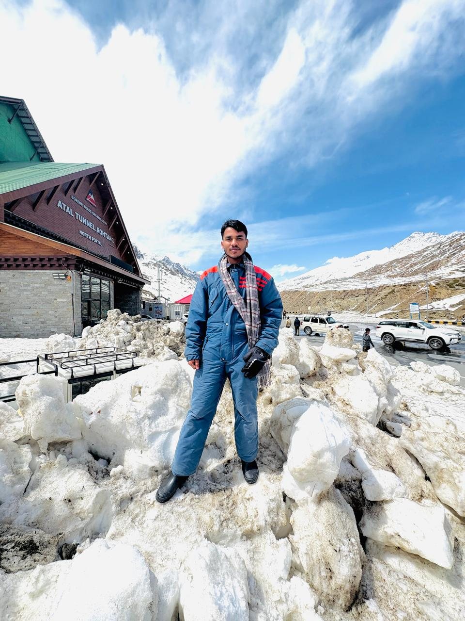 Ayush Gupta standing in a snowy mountain landscape